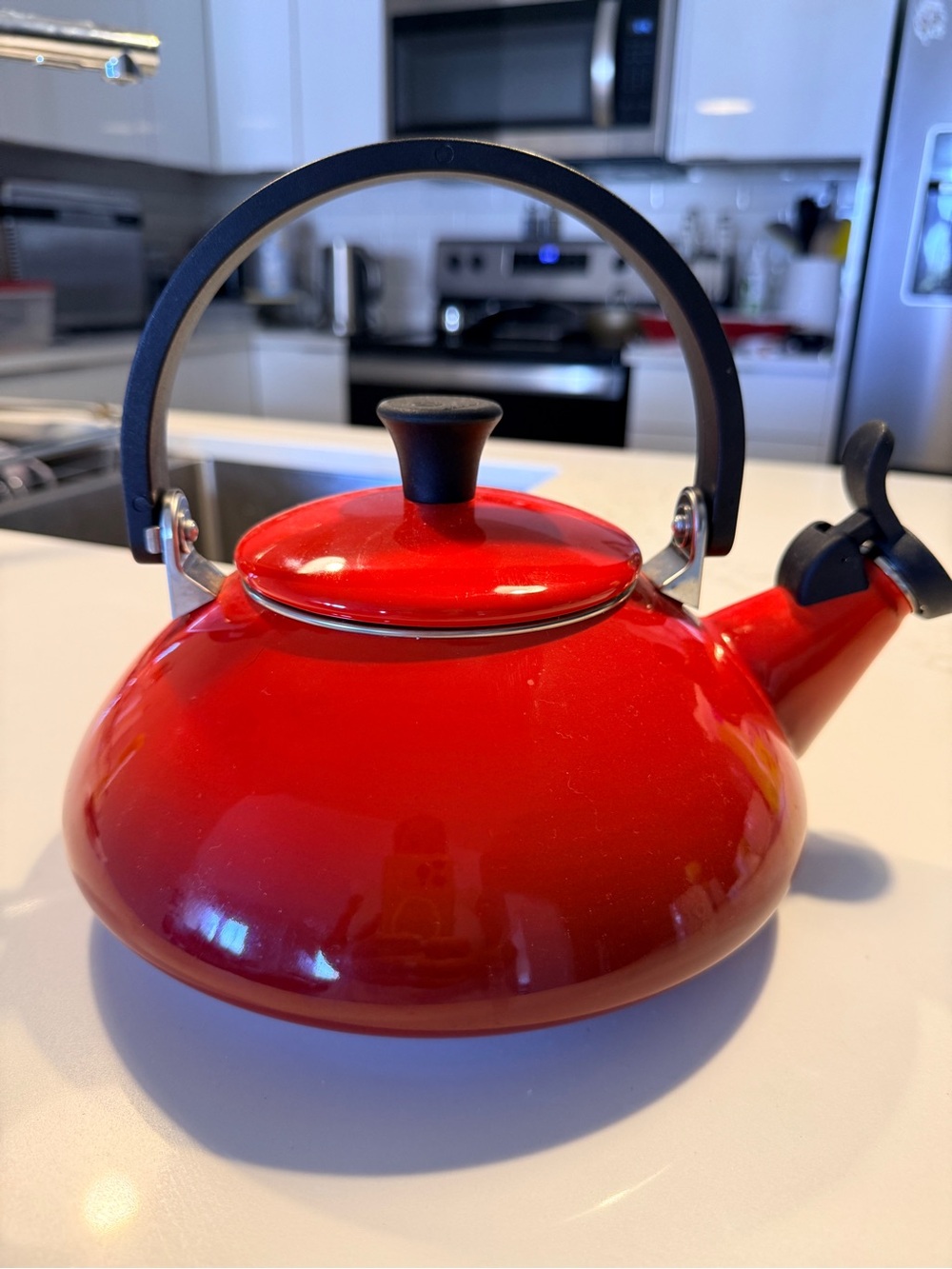 Le Creuset Red Enamel Whistling Tea Kettle with Black Handle